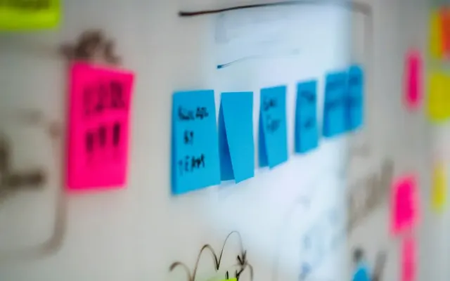 Colored planning notes on a whiteboard