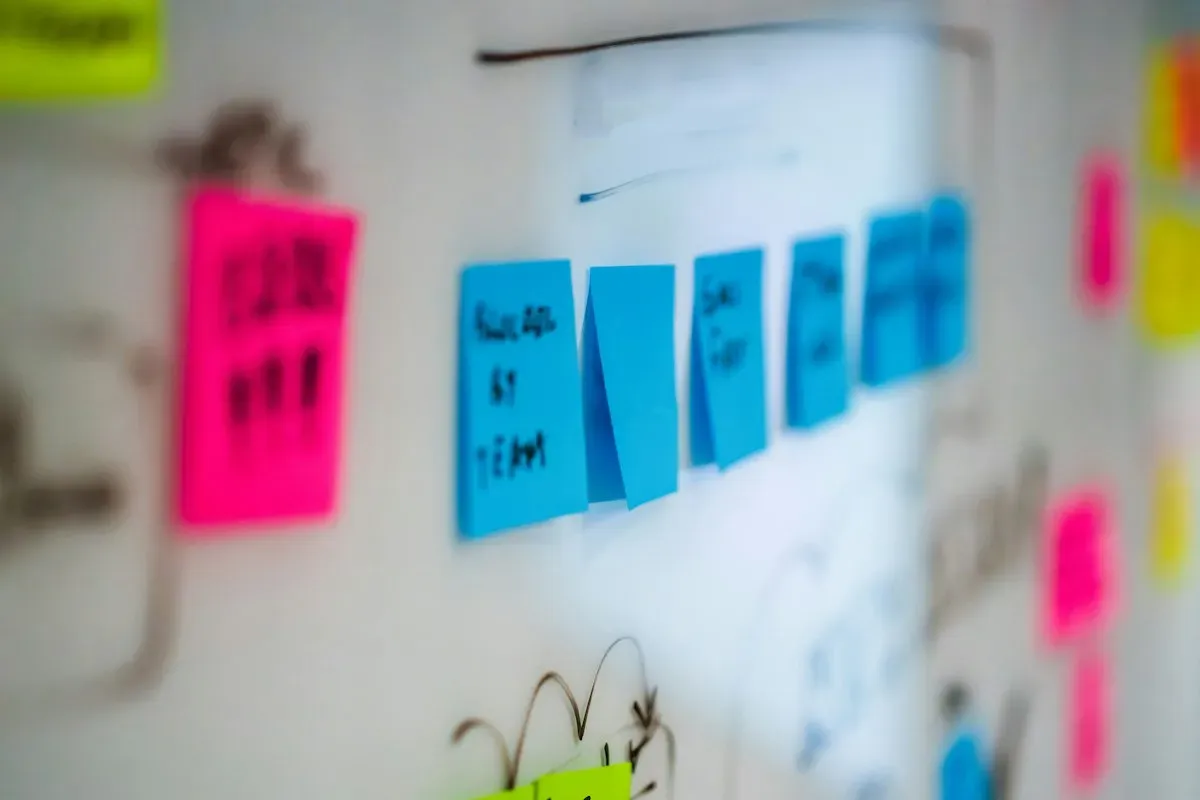 Colored planning notes on a whiteboard